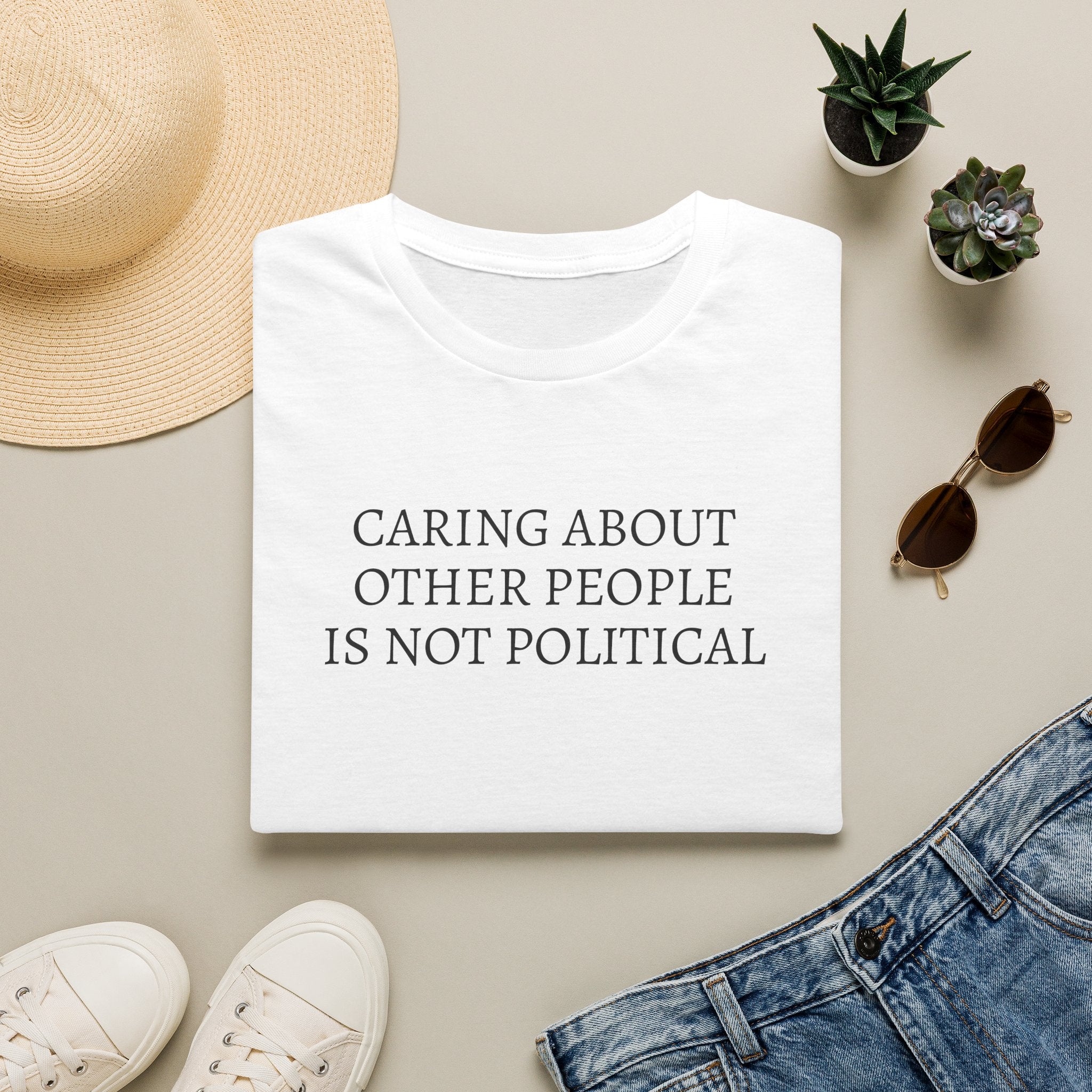 CARING ABOUT OTHER PEOPLE IS NOT POLITICAL T-SHIRT