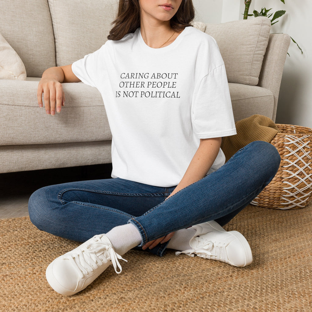 CARING ABOUT OTHER PEOPLE IS NOT POLITICAL T-SHIRT