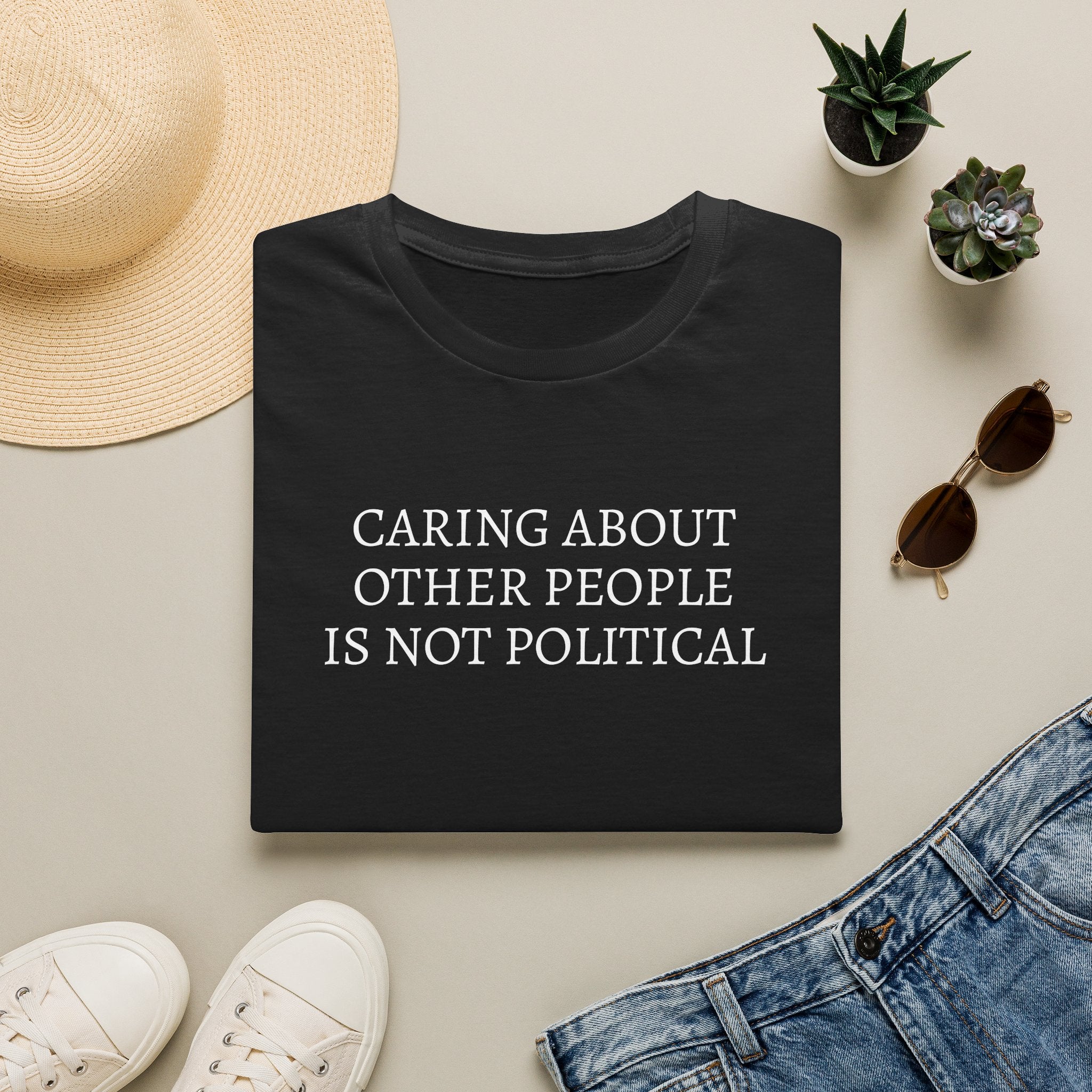 CARING ABOUT OTHER PEOPLE IS NOT POLITICAL T-SHIRT