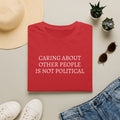 CARING ABOUT OTHER PEOPLE IS NOT POLITICAL T-SHIRT