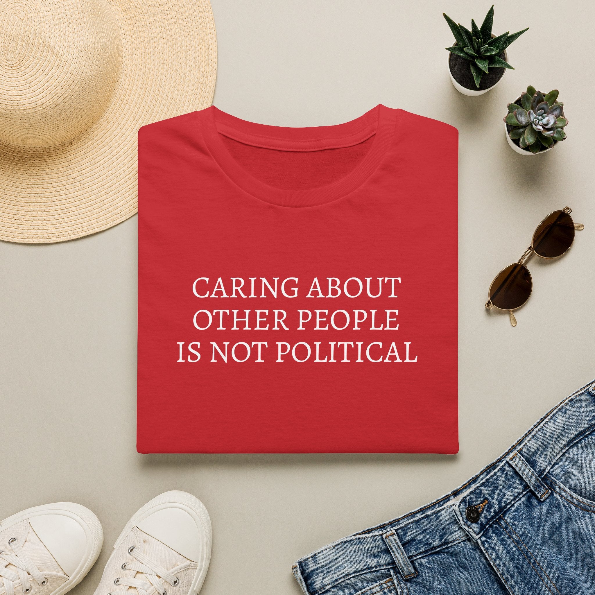 CARING ABOUT OTHER PEOPLE IS NOT POLITICAL T-SHIRT
